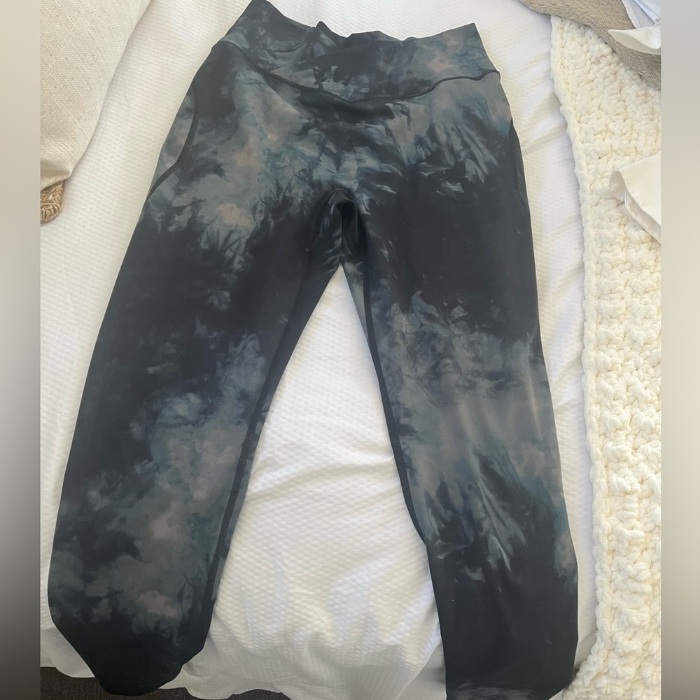 Lightly worn Alphalete Surface Power Legging in black oil stain, Cross Waist